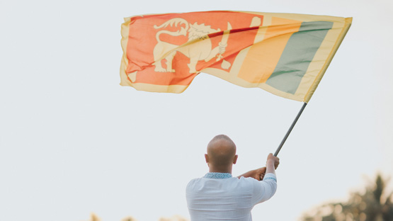 Vision - Man holding Sri Lankan Flag